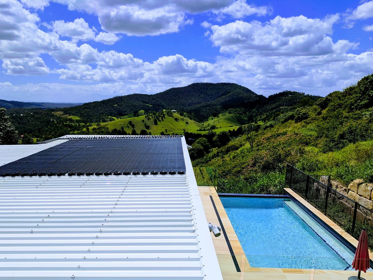 solar panels on roofs to heat swimming pools