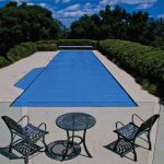 Ultra Thermal pool cover fully extended over a large outdoor pool