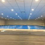 Ultra Thermal pool cover installed on an indoor commercial swimming pool