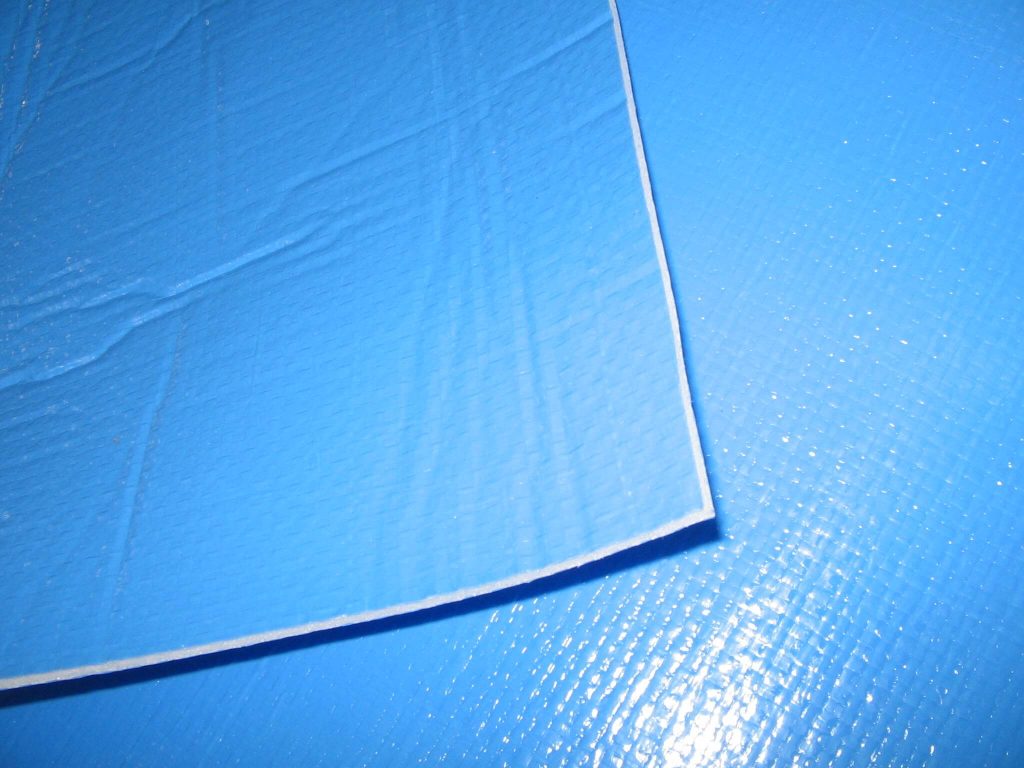 Close-up of the reinforced edge binding on an Ultra Thermal pool cover