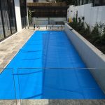 Ultra Thermal pool cover covering a small courtyard swimming pool
